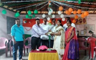 Handing over of cheque towards a teacher's salary to DK ZP HP School Bengre